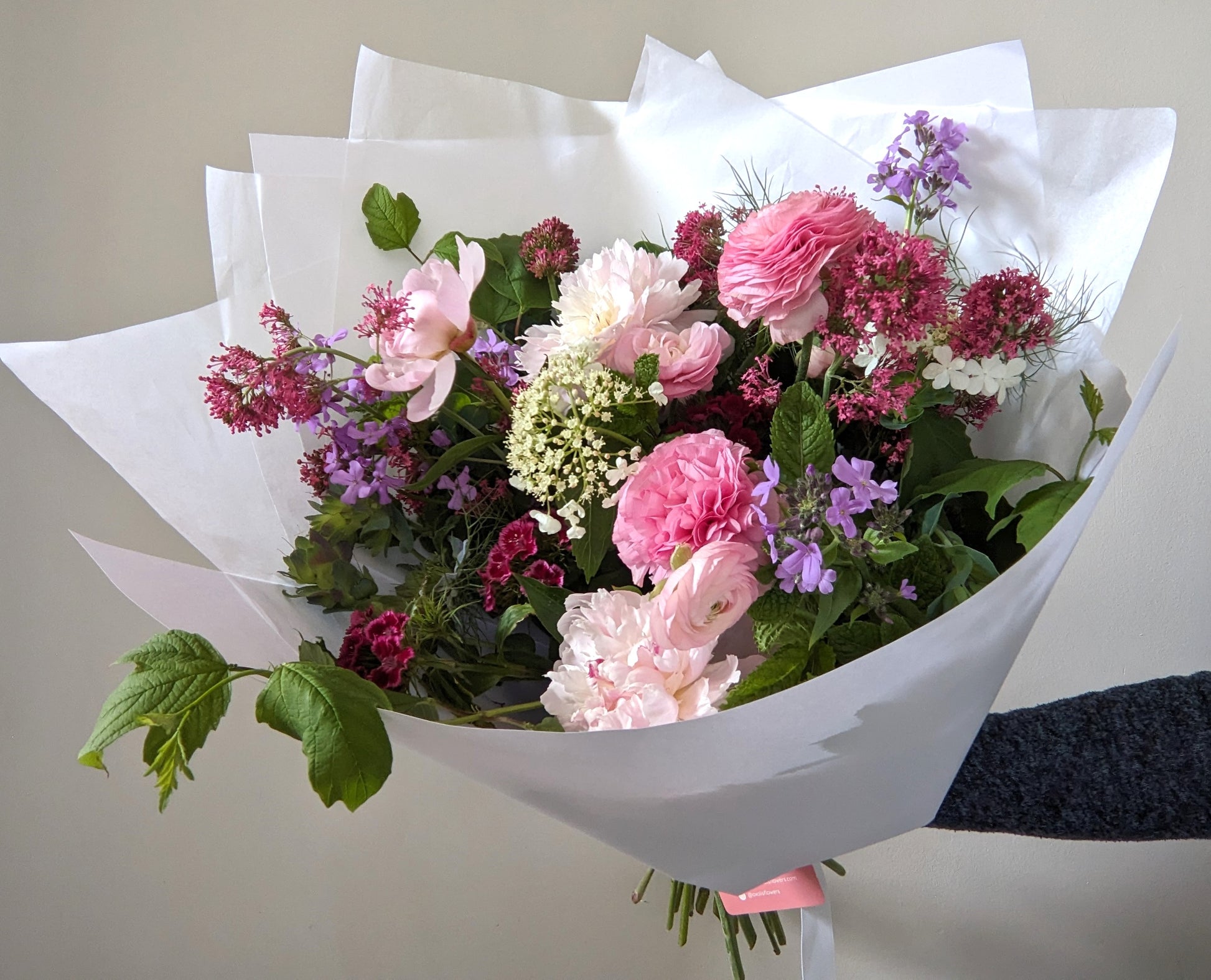 bouquet of British spring flowers in pink and purple